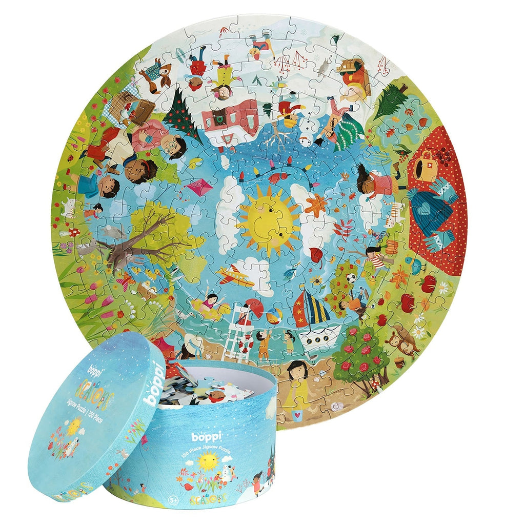 Ronde kinderpuzzel met seizoenen-thema en bijpassende opbergdoos, kleurrijke illustratie van natuur, kinderen en dieren.