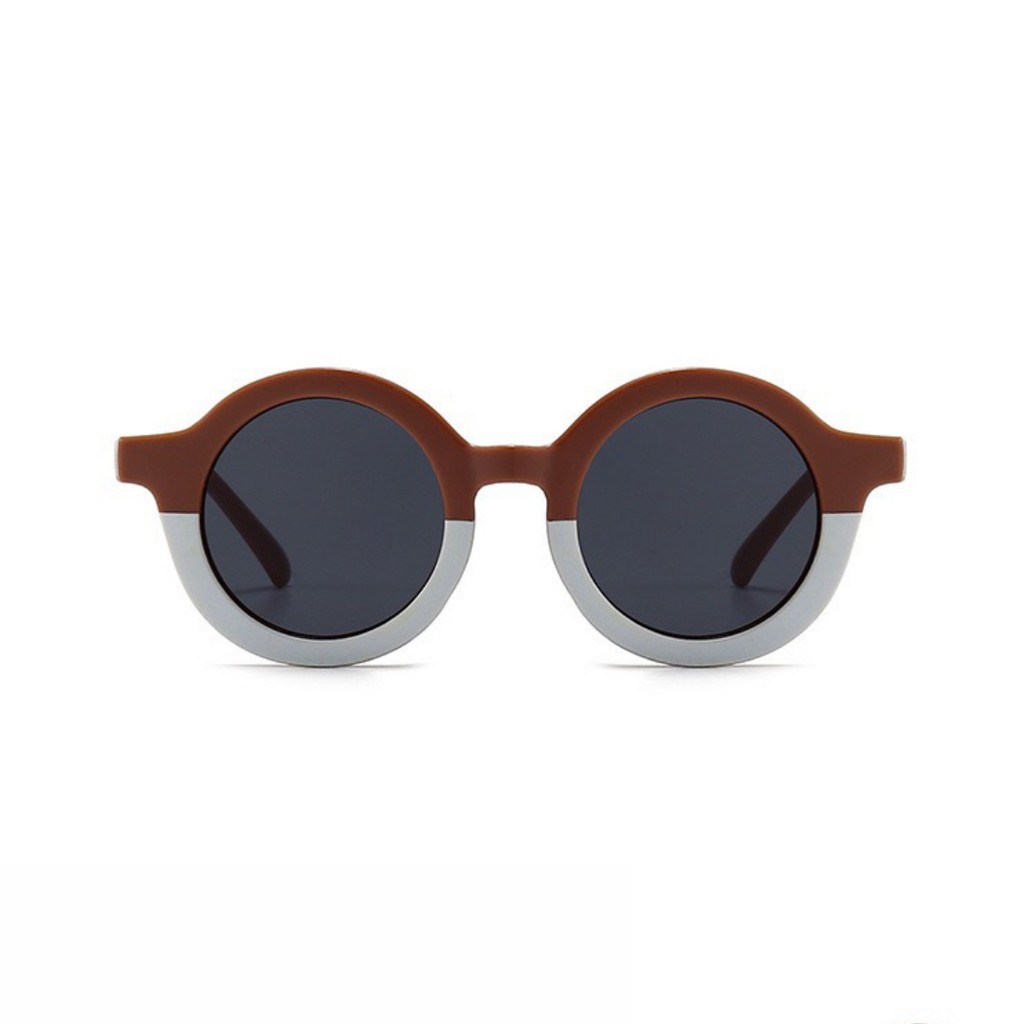 Ronde kinder zonnebril poederroze met licht contrast frame en UV bescherming