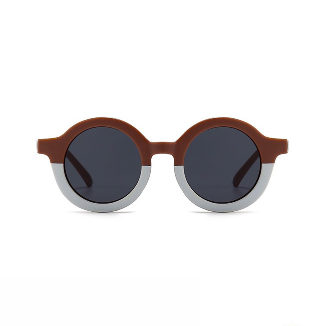 Ronde kinder zonnebril poederroze met licht contrast frame en UV bescherming